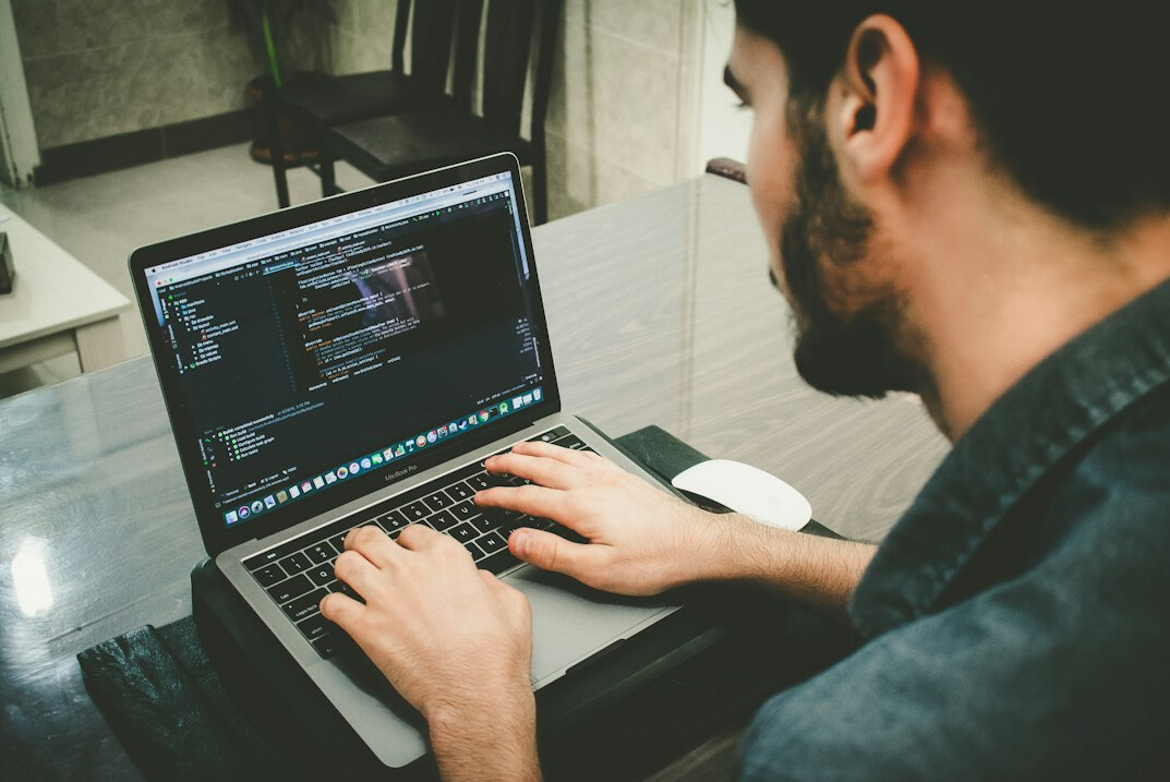 person learning programming on laptop