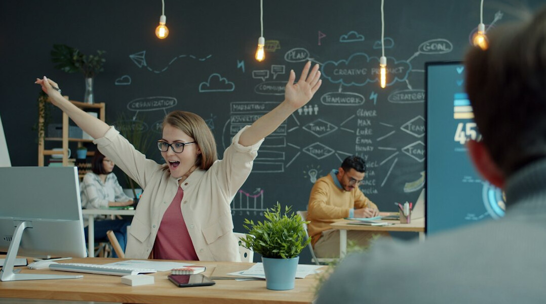 person celebrating coding success